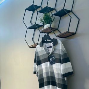 The brand of this shirt is Cremieux. It is a size small and is brand new